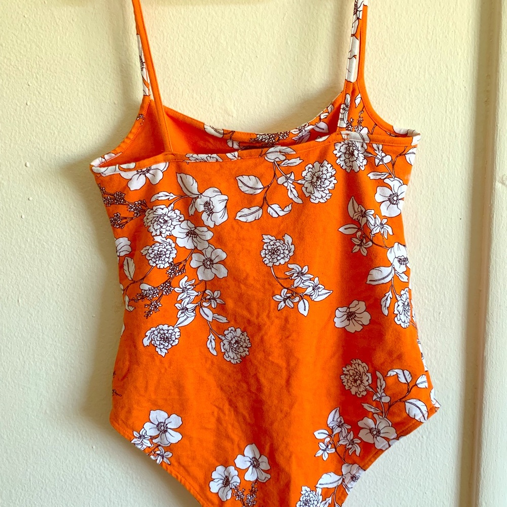 Orange body suit